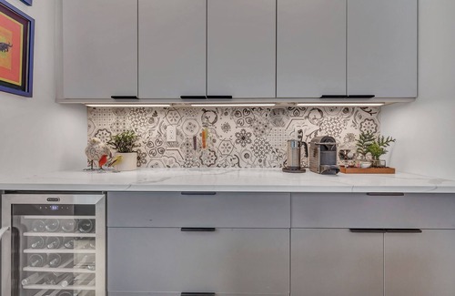 Old Lyme House | Luxurious midcentury modern glass house in the woods, chefs kitchen & great art