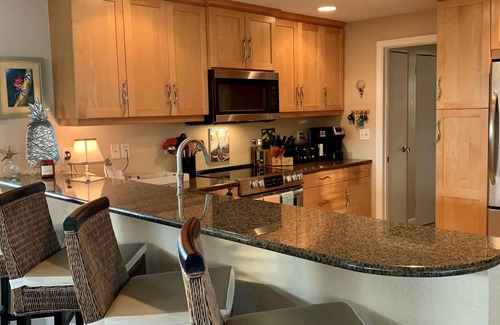 Whitney Beach House | Luxurious waterfront home with pool & spa…serene beach 5 min stroll away.