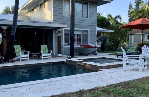 Whitney Beach House | Luxurious waterfront home with pool & spa…serene beach 5 min stroll away.