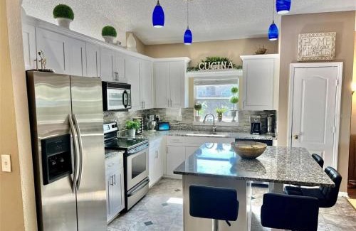 Orlando Villa | Luxurious Waterfront Retreat 4BR 3BA with Pool & BBQ