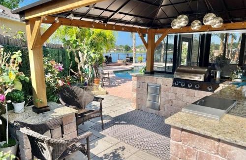 Orlando Villa | Luxurious Waterfront Retreat 4BR 3BA with Pool & BBQ