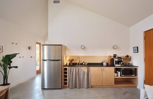 Stonewall Cabin | Luxury 1 BR cabin in the center of the Texas Wine Country with private porch, hot tub, gas grill and fire pit.