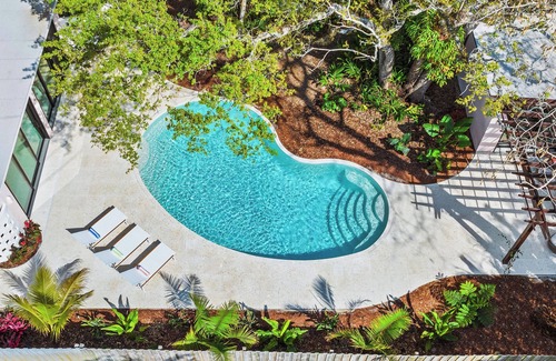 Central Beach House | Luxury 3BR, 3BA w/heated saltwater pool–10min walk to Beach, Shops, Restaurants!