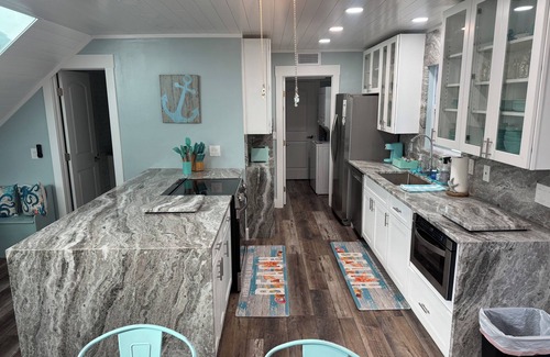 New Smyrna Beach House | Luxury 3BR Townhouse Walk to Beach Pet-Friendly Boat Parking Sleeps 10
