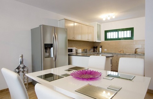Puerto del Carmen Apartment | Luxury apartment, large private sun terrace, full UK TV, WiFi, immaculate pool.