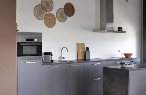 Stellendam House | Luxury apartment on the first floor with a private terrace and waterfront view.