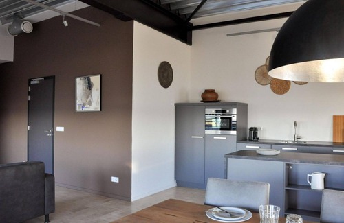 Stellendam House | Luxury apartment on the first floor with a private terrace and waterfront view.