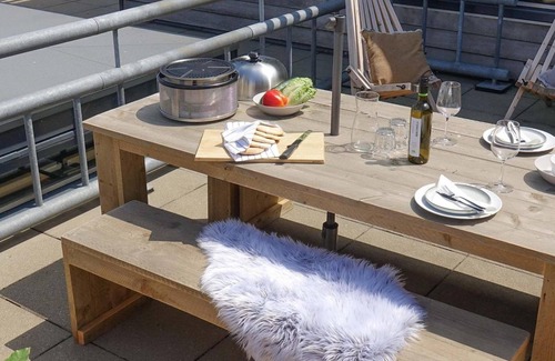 Stellendam House | Luxury apartment with private terrace, spacious living room, and stunning views of the marina.