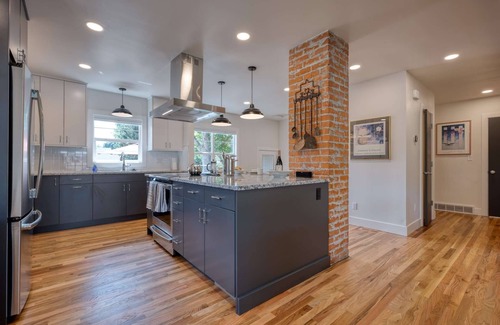 Collister House | Luxury at its Finest | Indulge in Gourmet Kitchen, Spacious Dining Area, Lovely Patio & Plush Beds