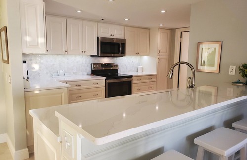 Isla del Sol Condo | LUXURY BAHIA POINTE WATERFRONT Condo/Panoramic Views! Dolphins, Manatee, More!
