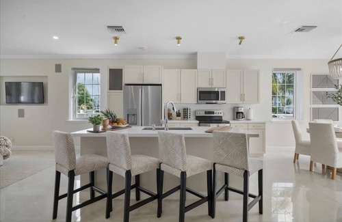 Palm Cay House | Luxury Beach side escape, steps from private beach, restaurant, marina, and café