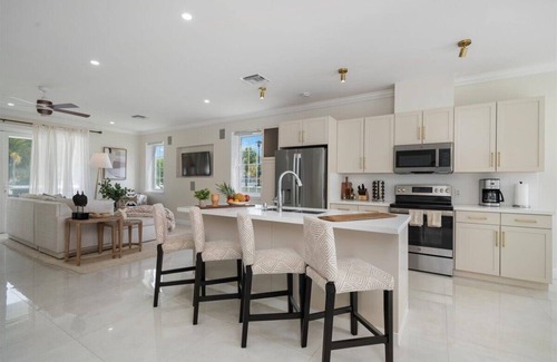 Palm Cay House | Luxury Beach side escape, steps from private beach, restaurant, marina, and café