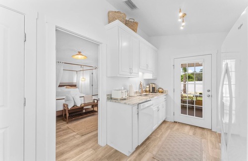Fort Bay House | Luxury beach home with golf cart in walking distance to the beach!