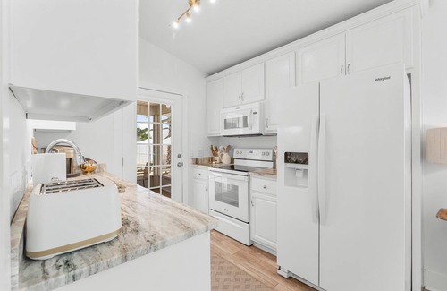 Fort Bay House | Luxury beach home with golf cart in walking distance to the beach!