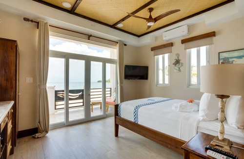 Placencia Resort | Luxury Beachfront Cabana with swim up pool bar