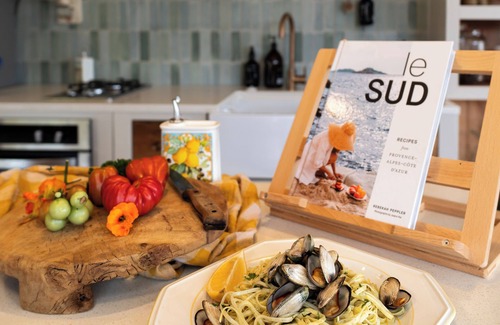 Pouto Cottage | Luxury eco-design waterfront fishing Batch with guests' vegetable garden.