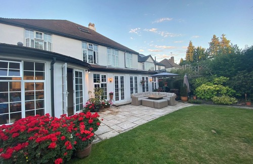 Whyteleafe House | Luxury family home in Surrey, UK with garden, pool table, fireplace & playground