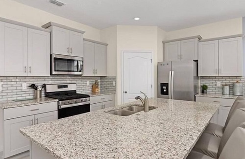 Sunridge Woods Villa | Luxury Family Villa with Themed Rooms, Pool, Spa & Games Room Near Disney