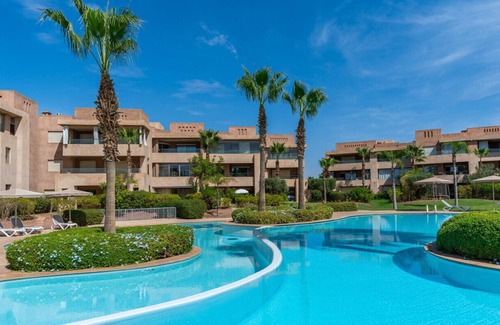 Menara Apartment | Luxury Garden-level Apartment With Poolside Serenity