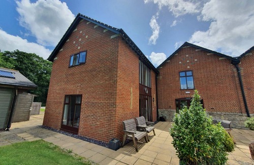 Woolland Cottage | Luxury barn conversion sleeping 16 with hot tub and ensuite bedrooms