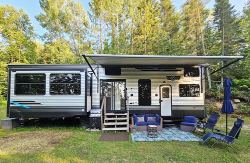 Waubun RV Rental | Luxury Lakefront Glamping near Itasca State Park + wifi, fit pit, & gas grill