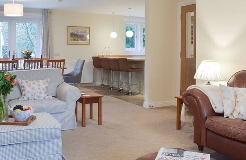 Carberry Cabin | Luxury lodge, set in 40 acres of beautiful private gardens at Carberry Tower Estate.