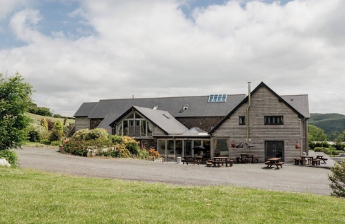 Devils Bridge House | Luxury renovated barn with a large hot tub and disabled friendly. Sleeping 17