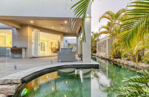 Pelican Waters House | Luxury resort style villa pool by Custom Bnb Hosting