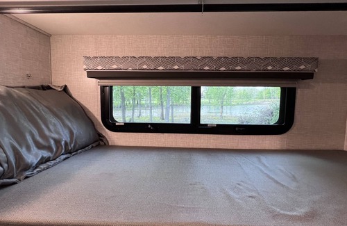 Walker House | Luxury RV with Bunkbeds Stationed near a Serene River