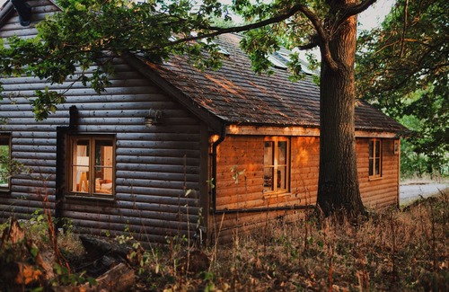 Earls Colne Cabin | Luxury secluded lakeside cabin with hot tub. Pet Friendly!