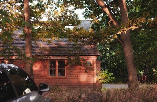 Earls Colne Cabin | Luxury secluded lakeside cabin with hot tub. Pet Friendly!