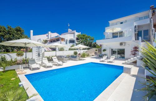 Punat Villa | Luxury villa Punat with pool with sea view , 50m from the beach by WiiBuk
