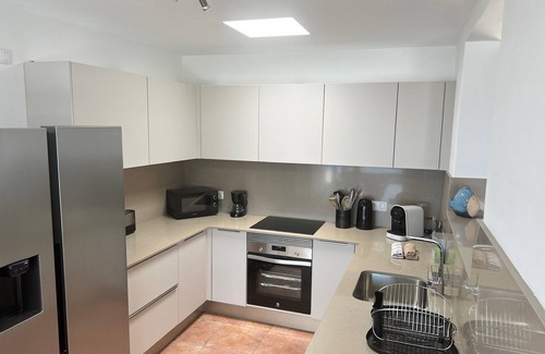 Playa Blanca Villa | Luxury villa - with a heated pool, hot tub, sea views, aircon, WiFi, UK TV