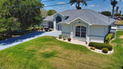 Fort Myers House | Luxury Waterfront Vacation Home with Dock and free heated Pool