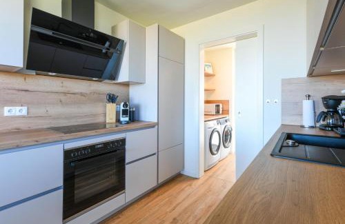 Marienleuchte Apartment | Lykke – Traumhafte Ferienwohnung mit Garten und Meerblick in erster Reihe!