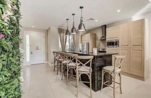 Almont House | Magic Village Townhouse, Minutes from Disney, Pool, Grill