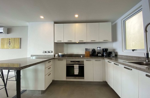 Brisas del Marques Condo | Magical sunsets, king bed, and pro service B403