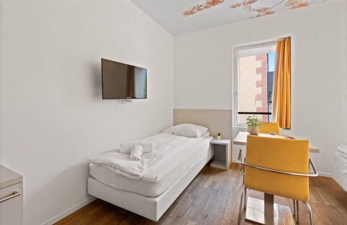 Sierre Hotel | Magnificent triple room in the heart of Sierre