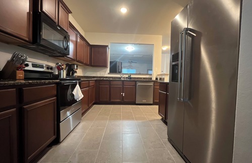 Waller County House | Magnolia Blooms: Spacious 5-BR 3.5 BA, tranquil, vibrant community.