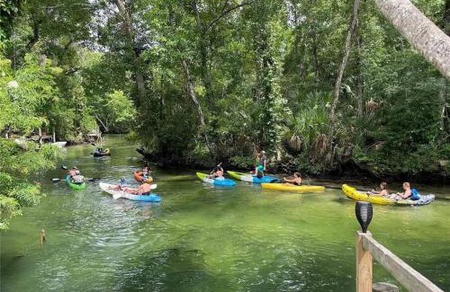 Weeki Wachee Gardens Villa | Main River Retreat hot tub, canoe with trolling motor