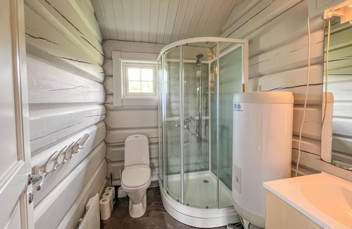 Nord-Torpa House | Make yourself comfortable in this open-plan log cabin with a wonderful view of the countryside.