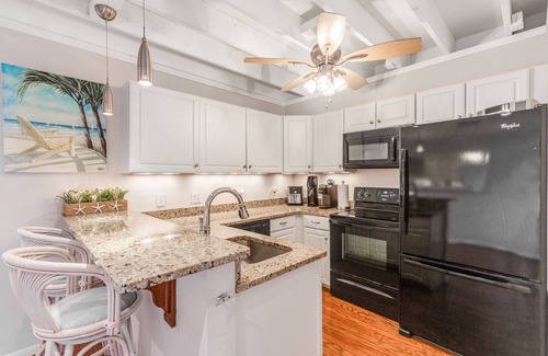 Selbyville House | Mallard Lakes townhouse with hot tub, pool, water views, & fireplace