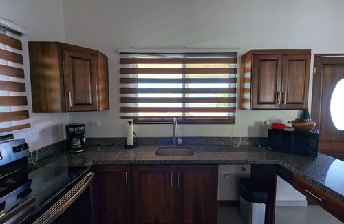 Escobal House | Mango Sunrise Retreat Modern 3-Bedroom House AC Mountain Views Saltwater Pool
