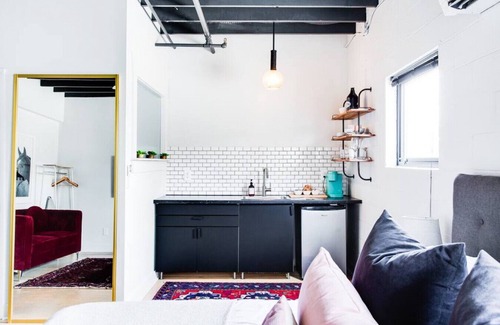 East Market District Apartment | Market #6 · Stellar Suites | Ruby King Suite in NuLu | Bikes