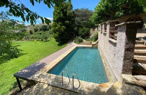 Riudecols House | Masía de piedra con piscina