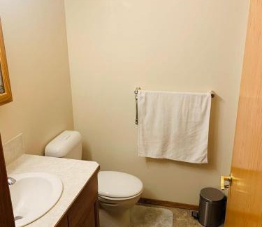 Airdrie House | Master Bedroom with attached bathroom