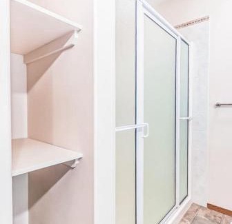 Airdrie House | Master Bedroom with attached bathroom