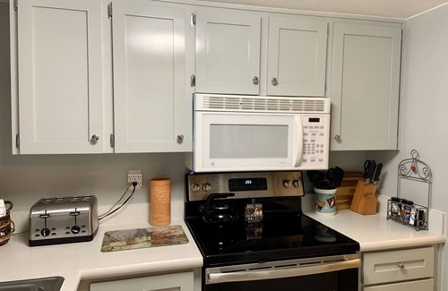 Point East Condo | Master Suite KING SIZE BED, Guest bedroom two FULL SIZE beds. Family discounts.