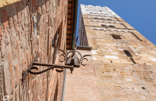 Lucca Historical Center House | Medieval Tower House alongside the Cathedral San Martino Bell Tower built 1204.