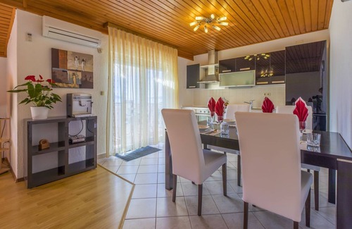 Povile Apartment | Mediterranean flat just 470 metres from the beach with sea view, baby cot, barbecue